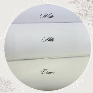 May include: Three fabric swatches in different shades of white: white, milk, and cream.