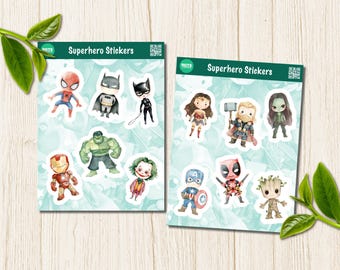 May include: Two sheets of superhero stickers featuring watercolor-style illustrations of various comic book characters. Each sheet has a dark green header with the text 'Superhero Stickers' and a QR code. The characters include Spider-Man, Batman, Catwoman, Hulk, Iron Man, Joker, Wonder Woman, Thor, Gamora, Captain America, Deadpool, and Groot.