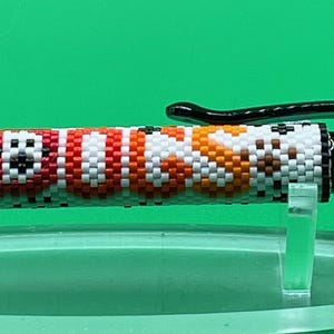 Beaded pen wrap: Dogs Rule, artist handmade beadwork