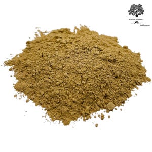May include: A close-up of a pile of light brown powder. The powder is finely ground and has a slightly rough texture.
