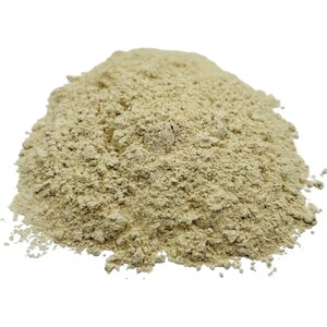 May include: A close-up of a pile of light beige ground ginger powder.