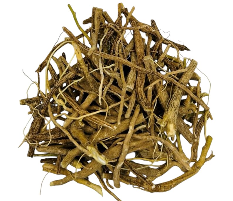 May include: A pile of dried, light brown roots and stems, possibly herbs or botanicals, against a white background. The roots vary in thickness and length, with some thinner, lighter-colored strands interspersed among the thicker, darker pieces.