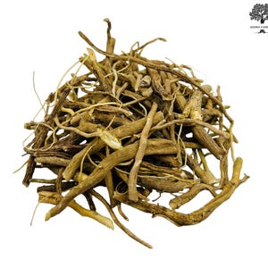 May include: A pile of dried, light brown Valerian root pieces, with a variety of shapes and sizes. The roots are arranged in a dense heap against a white background. The image is well-lit, highlighting the texture and color of the roots.