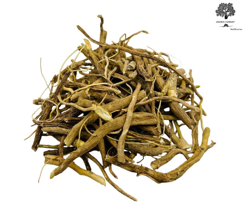 May include: A pile of dried, light brown Valerian root pieces, with a variety of shapes and sizes. The roots are arranged in a dense heap against a white background. The image is well-lit, highlighting the texture and color of the roots.