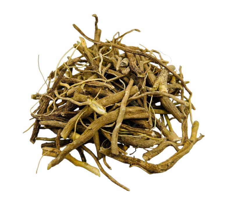 May include: A pile of dried, light brown Valerian root pieces, with a variety of shapes and sizes. The roots have a rough texture and are arranged in a dense, overlapping manner against a white background. The image highlights the natural, organic appearance of the herbal product.