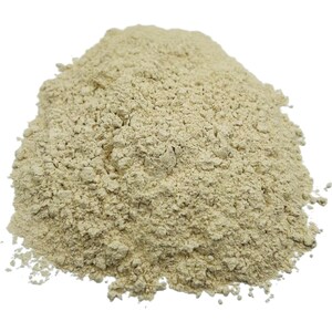 May include: A close-up of a pile of light beige ground ginger powder.