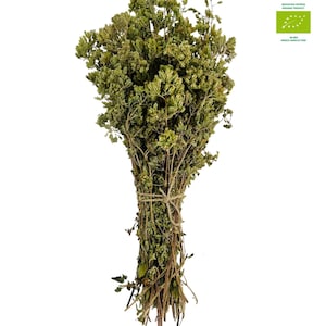 May include: A bunch of dried oregano tied together with twine. The oregano is green and brown and has a rustic look. The label says "Agros Market" and "BIO-GR ECO GREEK AGRICULTURE".