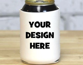 May include: White can cooler with black text that says "YOUR DESIGN HERE".