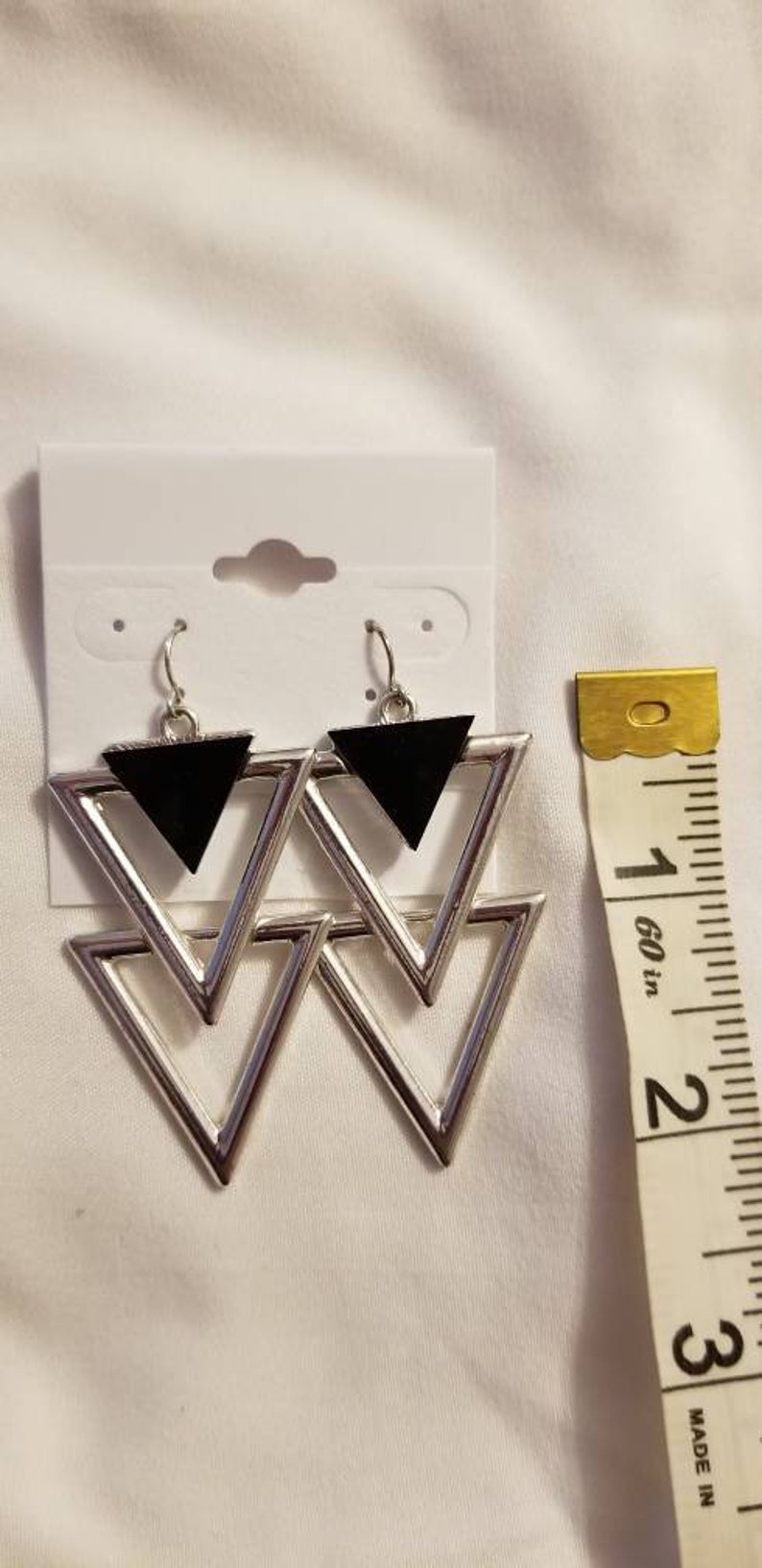 Double silver triangle pair of earrings with black triangle