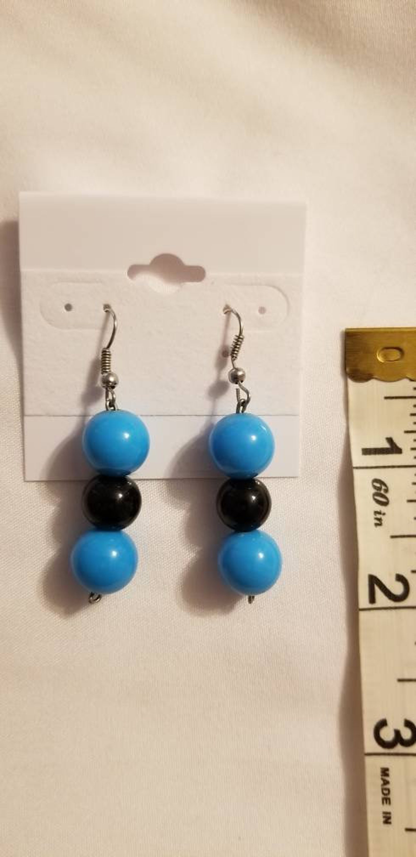 Hanging blue black ball earrings Etsy