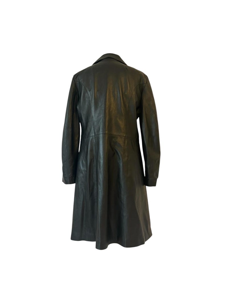 May include: A black leather coat with a classic design. The coat features a collared neckline, long sleeves, and a knee-length hem. The back view shows the coat's tailored fit and smooth texture.