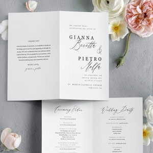May include: Wedding ceremony programme with a white background and black text. The programme includes the names of the bride and groom, Gianna Beretta and Pietro Molfa, the date and time of the ceremony, and the order of events. The programme also includes the names of the wedding party.