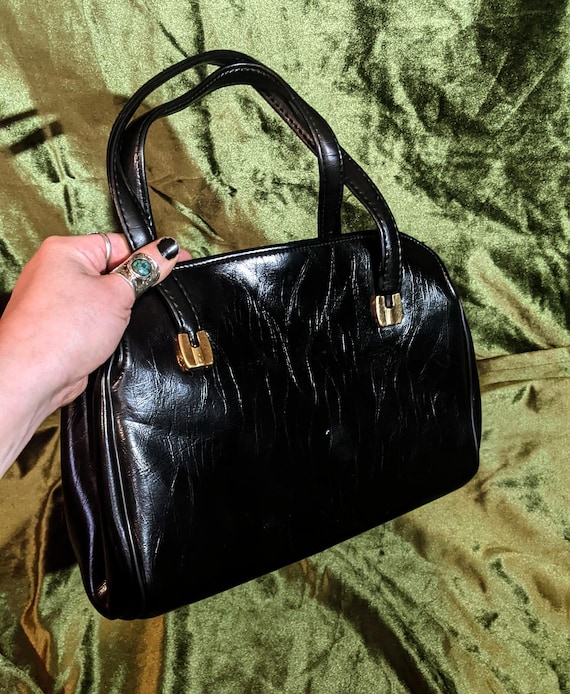 Borsa a tracolla in pelle nera con interno a fisarmonica vintage