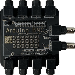 May include: A black Arduino BNC board with six BNC connectors, a reset button, and a QR code. The board has a text label that reads "Arduino BNC" and a URL: "github.com/jazziw/arduino_bnc".