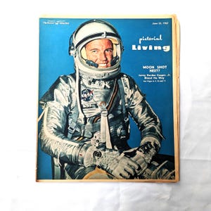 May include: A vintage magazine cover featuring an astronaut in a silver spacesuit, with the title "pictorial Living" and the headline "Moon Shot Next?"  Leroy Gordon Cooper, Jr. Blazed the Way. See Pages 1, 15 and 11.