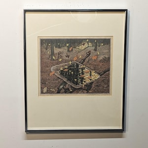 May include: A framed black and white woodcut print of a wheelbarrow filled with autumn leaves. The leaves are scattered around the wheelbarrow and on the ground. The print is titled "Autumn's Fall" and signed by the artist.