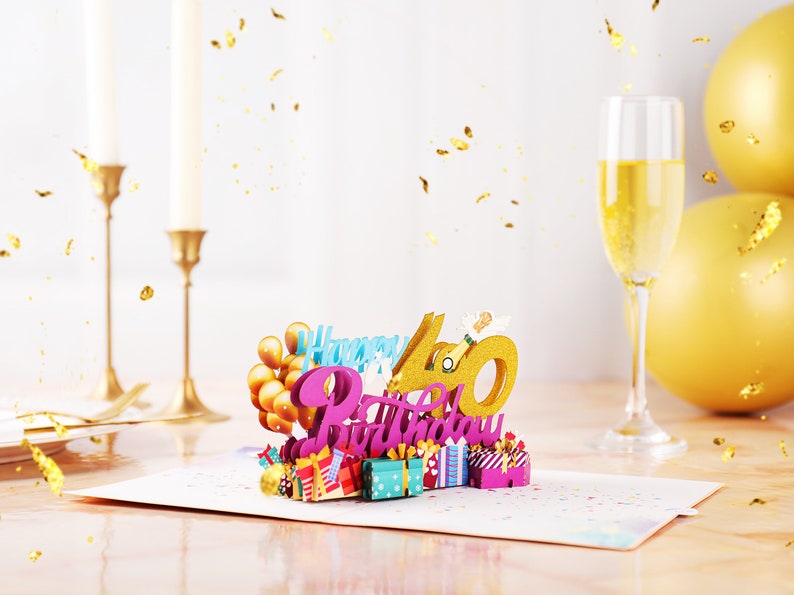 May include: A 3D pop-up card with the words "Happy 40th Birthday" in pink and gold glitter. The card features a champagne bottle, balloons, and presents.