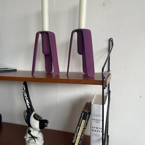 Pair of postmodern cast iron purple painted candle holders
