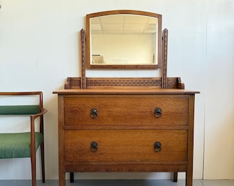Arts and Crafts style oak chest of drawers with vanity mirror early 20th century