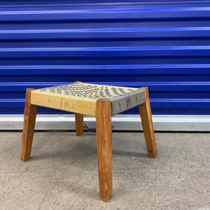 Cute little footstool with woven rope seat and slanted legs