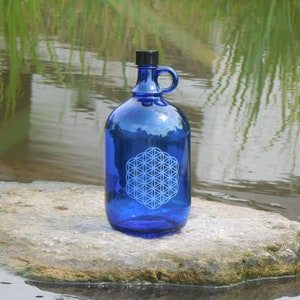 Blue glass 2 liter bottle with handle with flower of life