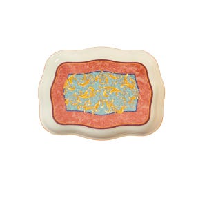 May include: A decorative serving tray with a scalloped edge. The tray features a light blue center with gold floral designs, framed by a red marble-like border and a white outer edge. The tray is designed for serving food or displaying items.