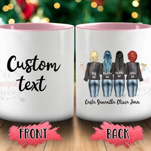 May include: White ceramic mug with a pink rim. The front of the mug says "Custom text". The back of the mug has a graphic of four women wearing denim jackets and jeans. The text "Big Sis, Middle Sis, Middle Sis, Little Sis" is written below the women. The names "Carla, Samantha, Olivia, Jenn" are written below the text.