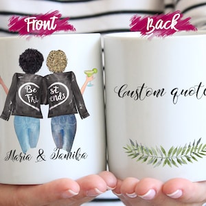 May include: Two white ceramic mugs featuring a graphic illustration of two people with different hair textures wearing black jackets with a heart design and the text "Best Friends" and "Maria & Tamika". The back shows the text "custom quotes" and a green leaf.