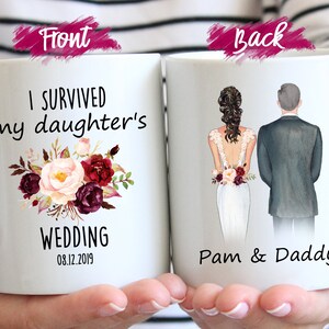 May include: White ceramic mug with a floral design and the text "I survived my daughter's wedding 08.12.2019". The back of the mug shows a cartoon illustration of a bride and groom with the text "Pam & Daddy".