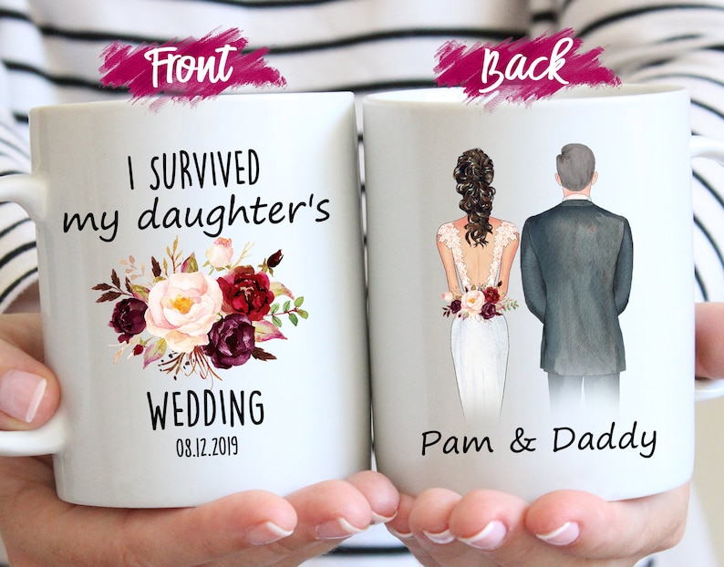 May include: White ceramic mug with a floral design and the text "I survived my daughter's wedding 08.12.2019". The back of the mug shows a cartoon illustration of a bride and groom with the text "Pam & Daddy".