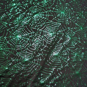 Halloween fabric green  spider web foiled on black stretch faric spider web  by the yard