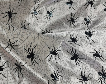 Satin Spiderweb Fabric: Black Spiders on White Stain (58" Wide)