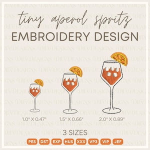 May include: An embroidery design featuring three Aperol Spritz cocktail glasses with orange slices. The text reads "tiny aperol spritz EMBROIDERY DESIGN". The sizes are 1.0" x 0.47", 1.5" x 0.66", and 2.0" x 0.89".