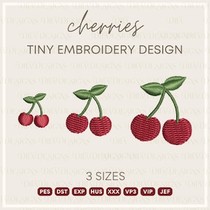 May include: An embroidery design showing three sets of red cherries with green leaves and stems. The text "cherries" and "TINY EMBROIDERY DESIGN" are at the top. The image also includes the text "3 SIZES" and file type abbreviations.