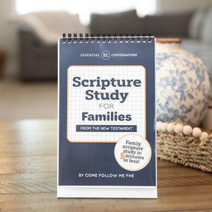 May include: A spiral-bound desk calendar titled Scripture Study for Families from the New Testament. The dark blue cover features a white grid box, the text Essential Conversations, and a circular badge stating Family scripture study in 5 minutes or less.