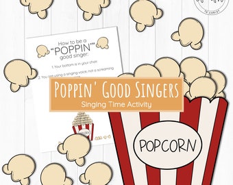 May include: A printable activity for children to learn about singing. The image shows a red and white striped popcorn box with popcorn kernels inside. The text "POPPIN' GOOD SINGERS" is in a yellow banner above the box. The text "Singing Time Activity" is below the box. The text "POPCORN" is on a white circle on the box. There are also several popcorn kernels scattered around the image.