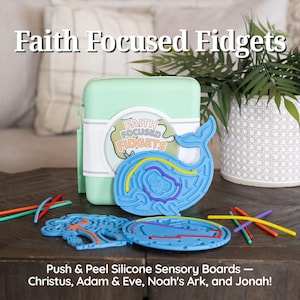 May include: A light green storage case with a Faith Focused Fidgets label, featuring blue silicone sensory maze boards shaped like a whale, a tree, and an ark, accompanied by colorful flexible sticks for push and peel play.