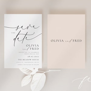 May include: Save the date card with a white background and black calligraphy. The card says "Save the Date" with the names Olivia and Fred and the date 28.07.2023. The card also says "The Meadow House" and "Formal Invitation to Follow".