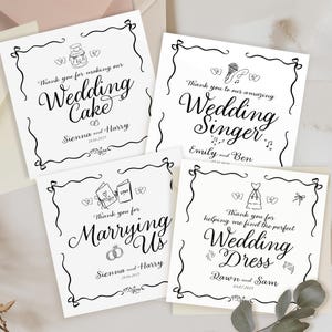 May include: Four square white thank you cards with black ink line drawings and calligraphy. Each card features a unique wedding-themed illustration, such as a cake, microphone, vows, or dress, along with personalized names and wedding dates.