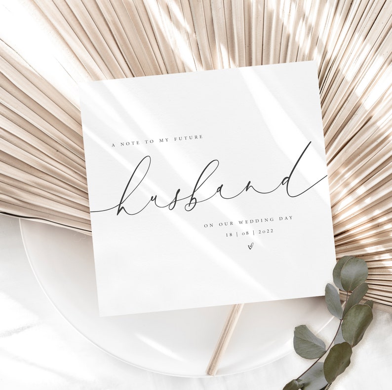 May include: A white card with black text that reads "A note to my future husband on our wedding day 18 | 08 | 2022".