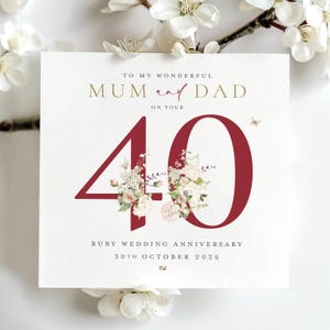 May include: A square greeting card for a 40th ruby wedding anniversary. The text reads TO MY WONDERFUL MUM and DAD ON YOUR 40, RUBY WEDDING ANNIVERSARY, 30TH OCTOBER 2026. The number 40 is in large dark red font with floral illustrations.