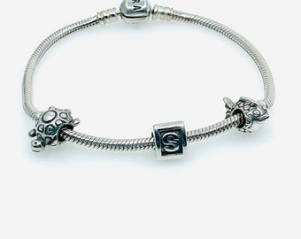 Authentic Pandora Moments Snake Chain Bracelet with Charms.