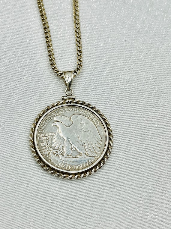 An unusual half dollar style Kennedy mounted coin pendant necklace, set  with a sterling silver chain