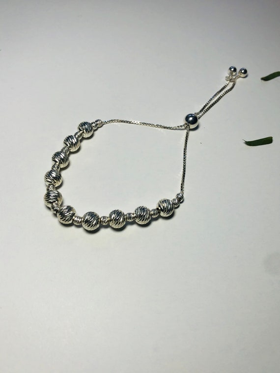 Sterling Silver Diamond - Cut Bead Bolo Bracelet. - image 1