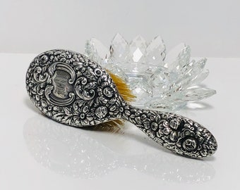 Antique 1896 - Repousse Hair Brush by GORHAM . in sterling silver.
