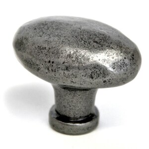 May include: A silver oval-shaped cabinet knob with a textured finish.