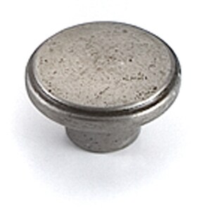 May include: A silver metal knob with a textured surface and a raised rim. The knob is round and has a small stem.