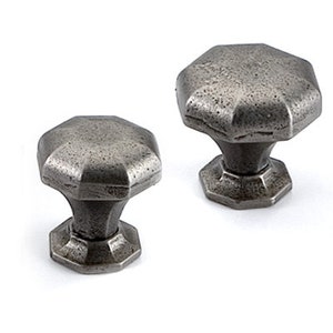 May include: Two silver-toned metal cabinet knobs with a hexagonal shape and a textured finish.