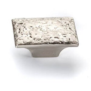 May include: A square cabinet knob with a hammered silver finish. The knob has a slightly raised base.