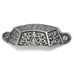 May include: A silver-toned, ornate, cast iron drawer pull with a floral design. The pull has a hexagonal shape and is approximately 5 cm wide.